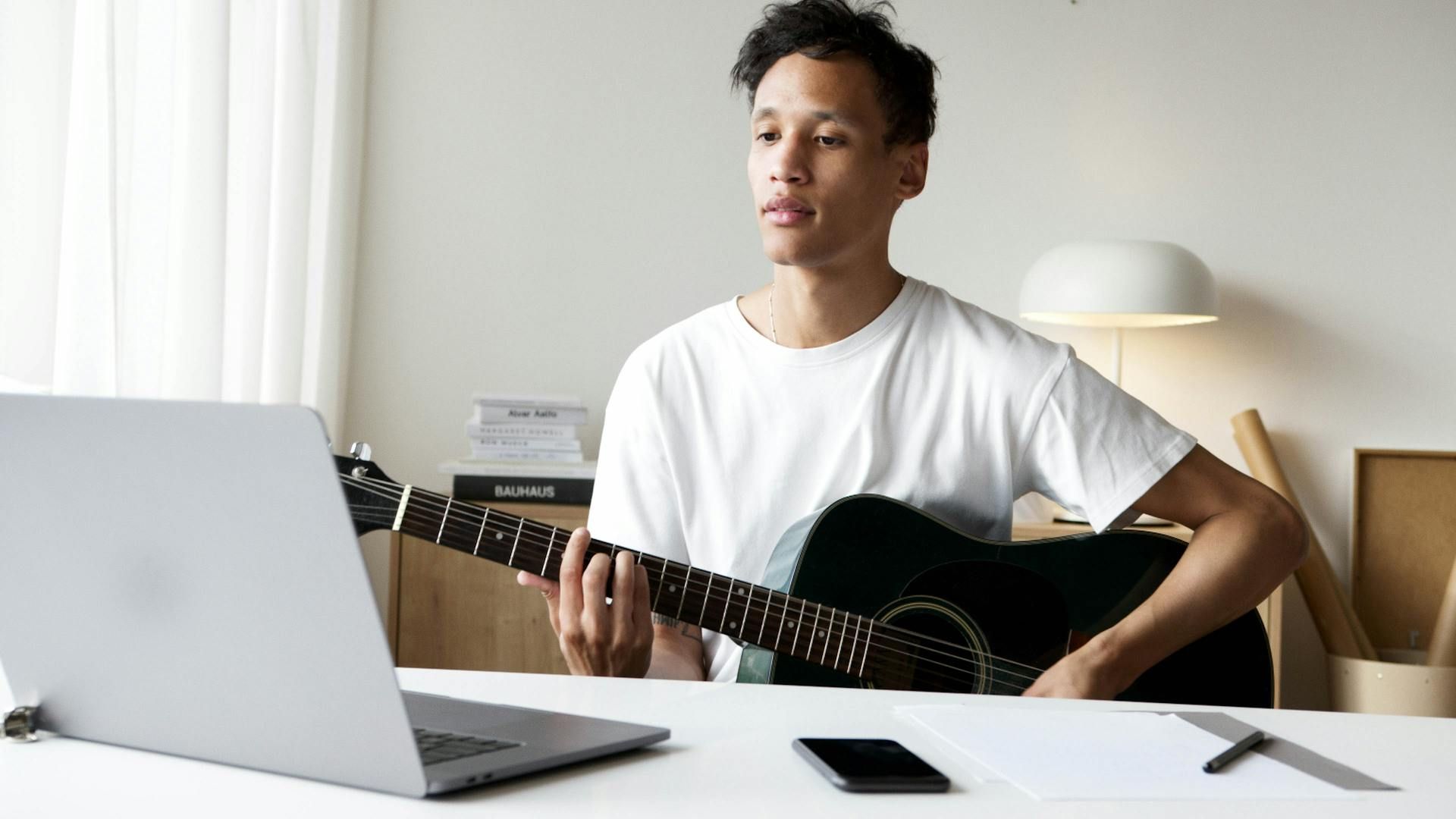 Worship guitarist playing at home